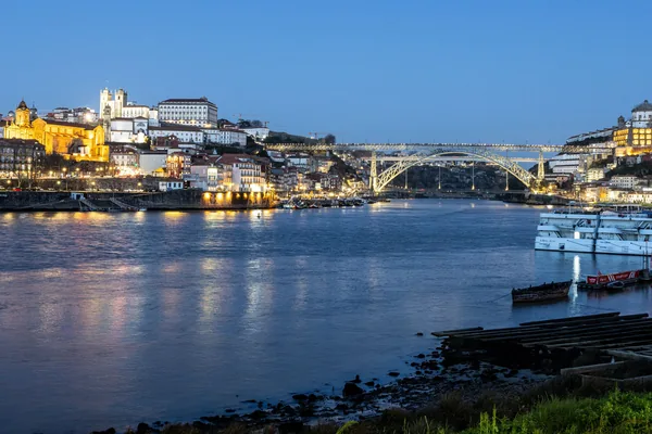 Porto riverside at dusk, with the Dom Luís I bridge