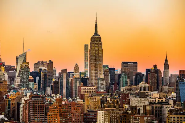 Manhattan skyline at sunset, with the Empire State Building